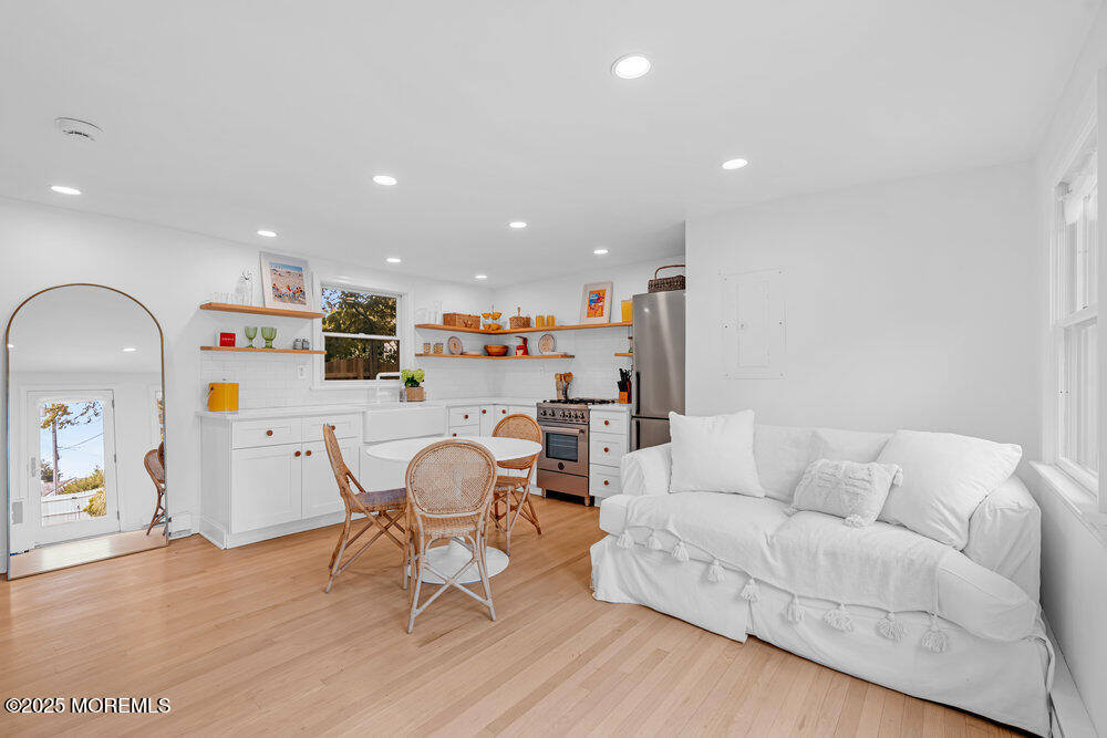 501 3rd Avenue Spring Lake, NJ 07762 - Photo 45 of 61 a living room with furniture and wooden floor