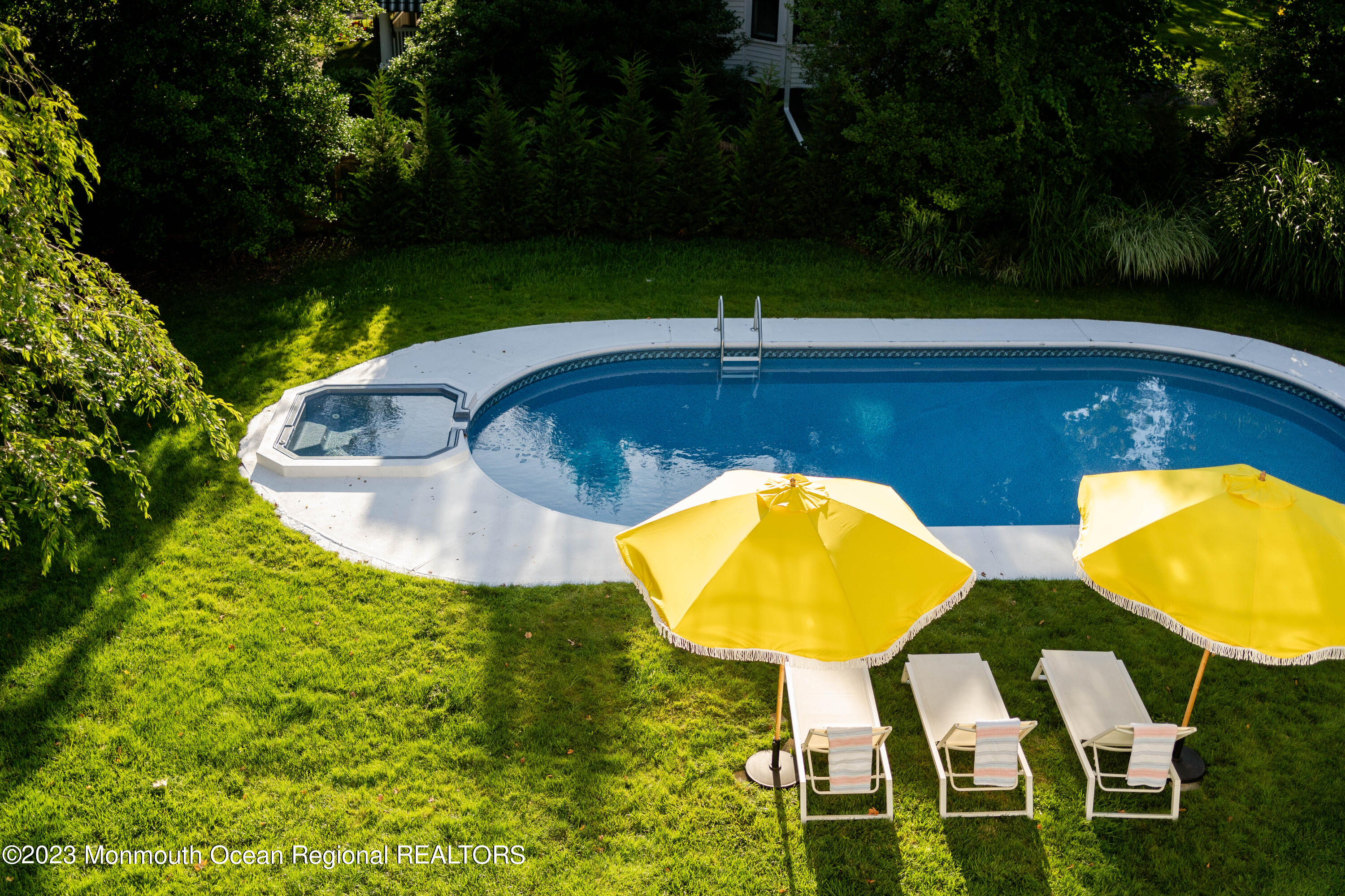 501 3rd Avenue Spring Lake, NJ 07762 - Photo 5 of 61 a view of a swimming pool with a table and chairs