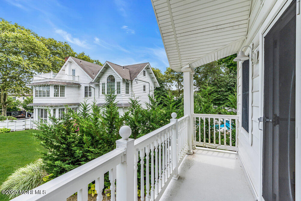501 3rd Avenue Spring Lake, NJ 07762 - Photo 56 of 61 a view of a house with porch and wooden floor