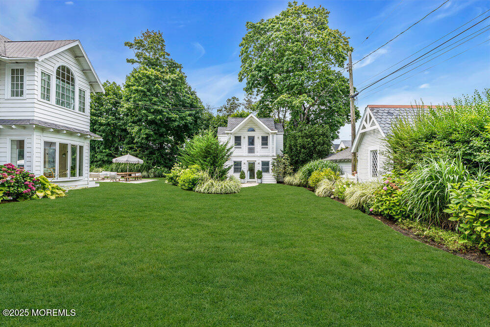 501 3rd Avenue Spring Lake, NJ 07762 - Photo 57 of 61 a front view of a house with a garden