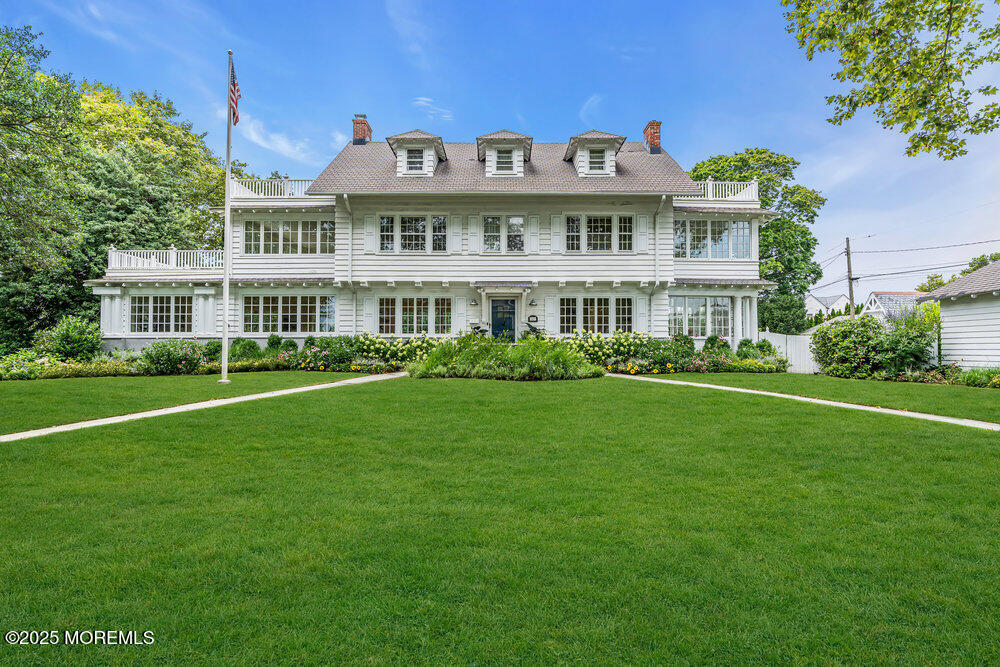 501 3rd Avenue Spring Lake, NJ 07762 - Photo 60 of 61 a front view of a house with garden and trees