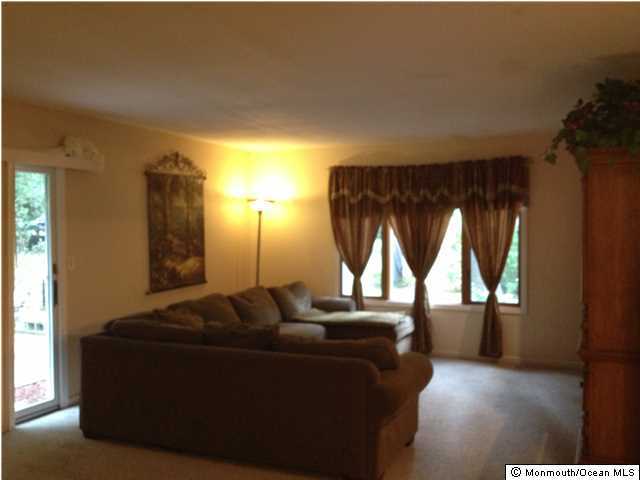 795 Hulses Corner Road Howell, NJ 07731 - Photo 2 of 22 a living room with furniture and a window