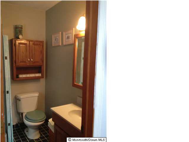 795 Hulses Corner Road Howell, NJ 07731 - Photo 12 of 22 a bathroom with a toilet and a shower