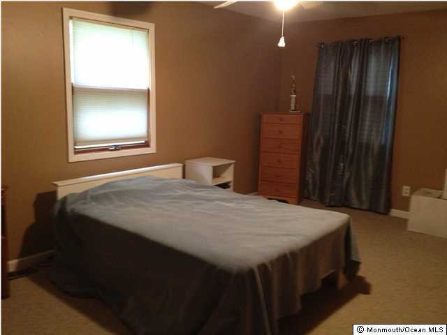 795 Hulses Corner Road Howell, NJ 07731 - Photo 13 of 22 a bedroom with a bed and a window