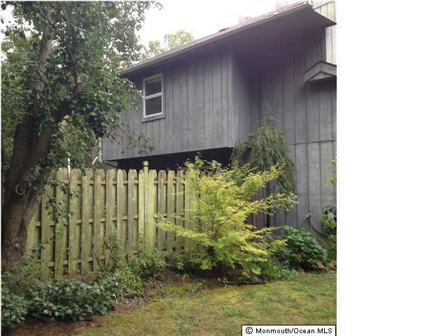 795 Hulses Corner Road Howell, NJ 07731 - Photo 18 of 22 a view of a house with a small yard plants and large tree