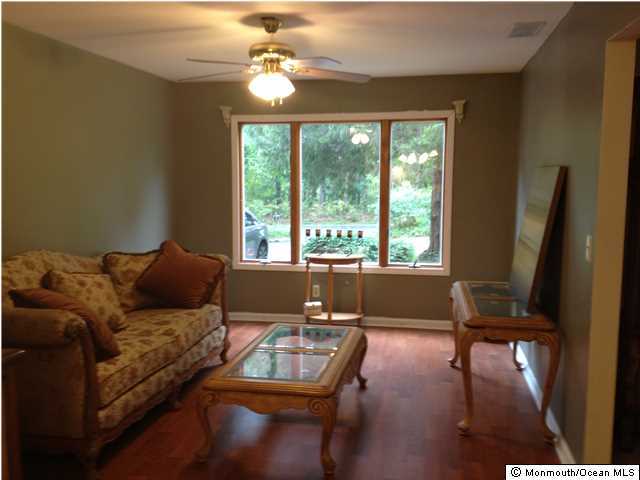 795 Hulses Corner Road Howell, NJ 07731 - Photo 3 of 22 a living room with furniture and a large window