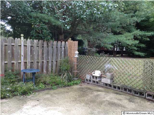 795 Hulses Corner Road Howell, NJ 07731 - Photo 21 of 22 a view of a chair and table in backyard