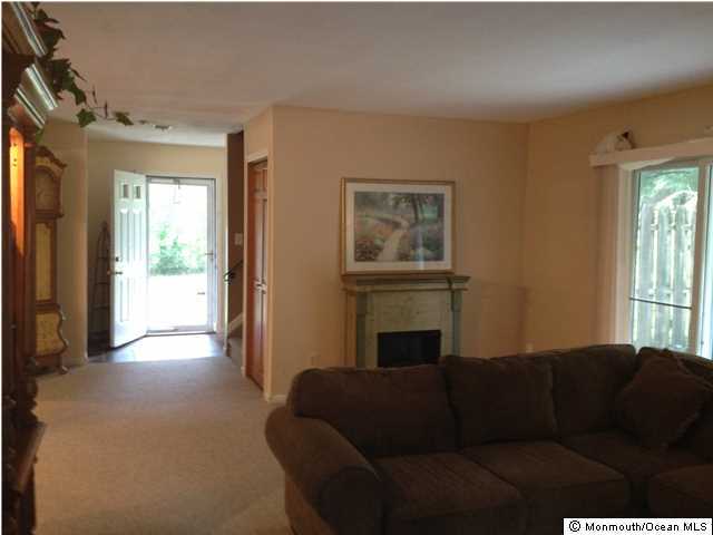 795 Hulses Corner Road Howell, NJ 07731 - Photo 6 of 22 a living room with furniture and a fireplace