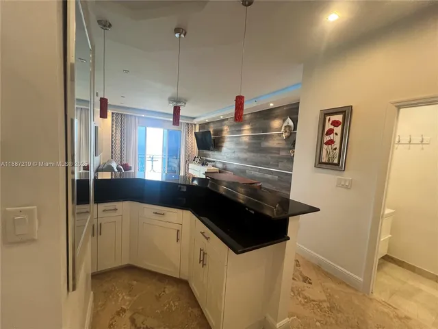 a kitchen with stainless steel appliances a refrigerator and a sink