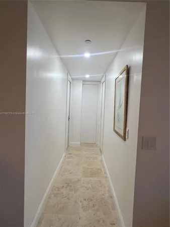 a view of a hallway with seating area