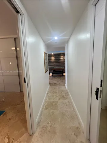 a bedroom with a bed and a television