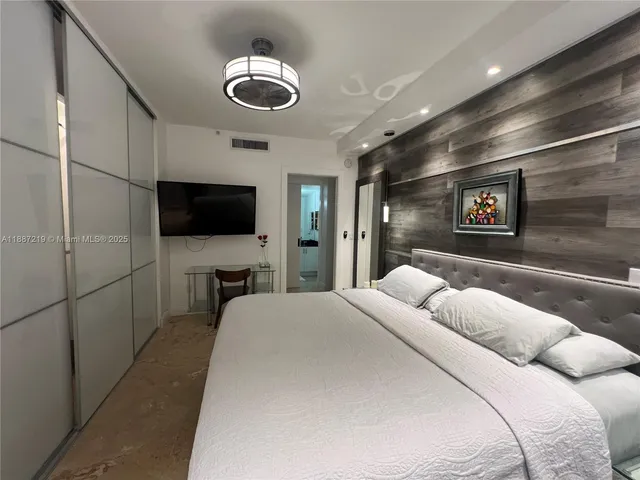 a kitchen with sink and mirror