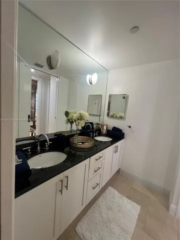 a dinning table sitting in a room next to a window