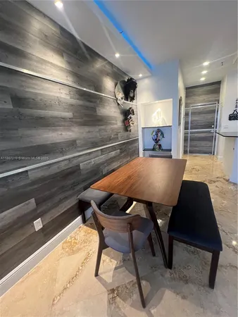 a bathroom with a toilet and a shower curtain