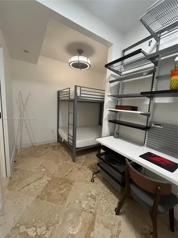 a bedroom with a bed and a table