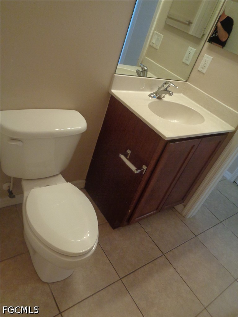 2463 Nature Pointe Loop Fort Myers, FL 33905 - Photo 38 of 50 a white toilet sitting next to a bathroom sink
