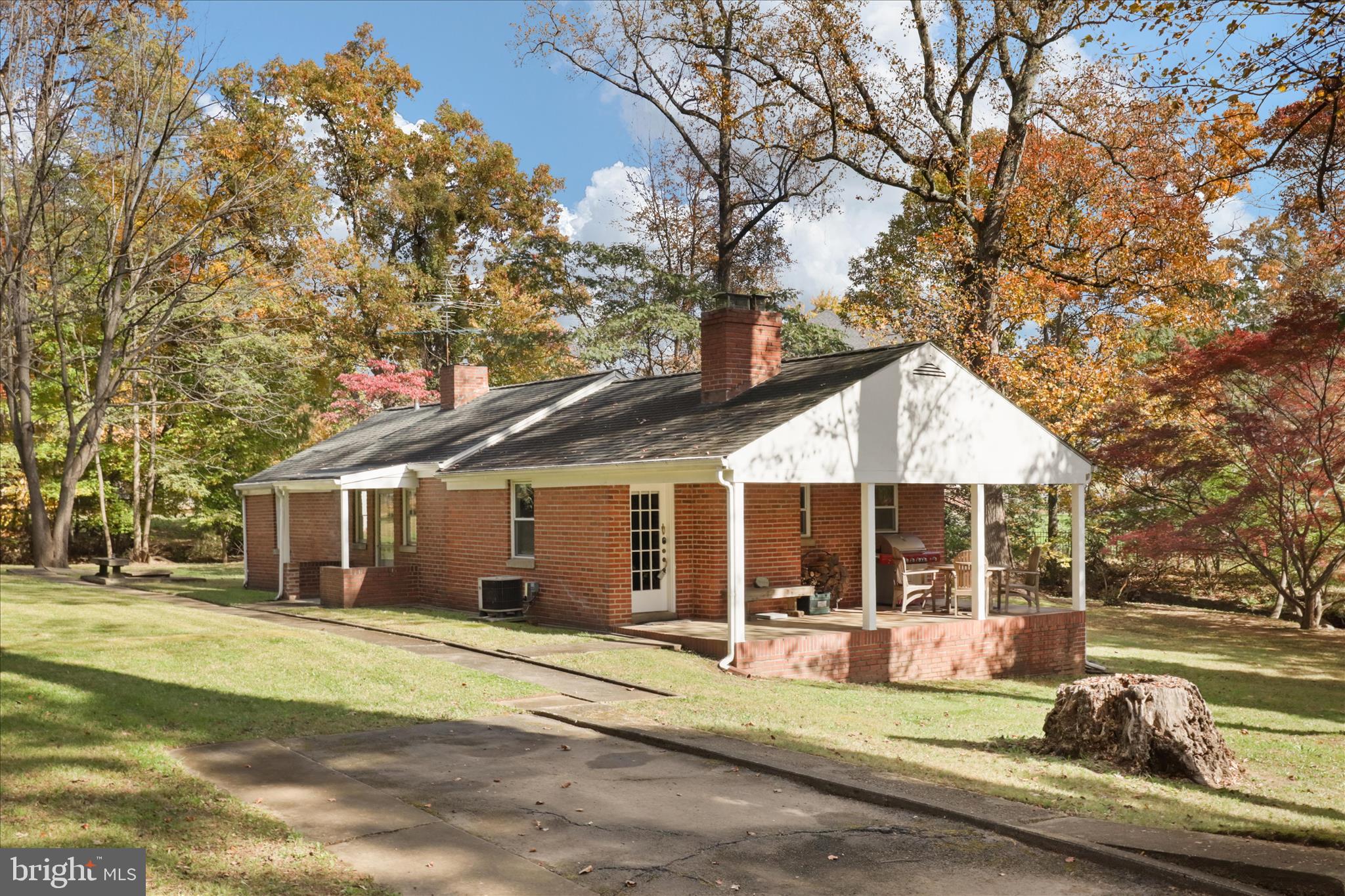 a view of a house with backyard porch and sitting area