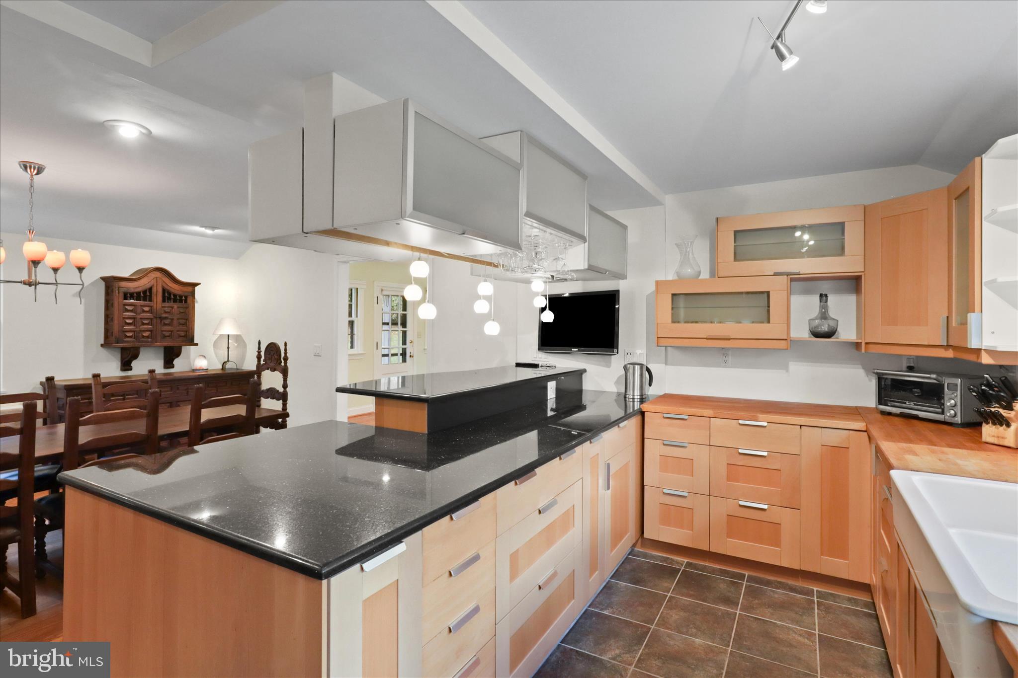 7914 Idylwood Road Dunn Loring, VA 22027 - Photo 13 of 41 a kitchen with stainless steel appliances granite countertop a sink and a stove