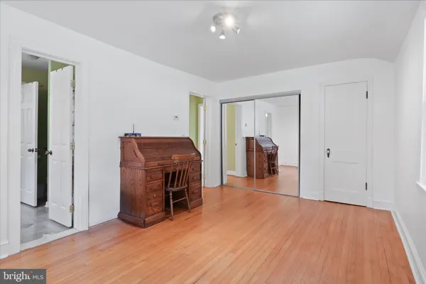a view of a livingroom with furniture and hallway