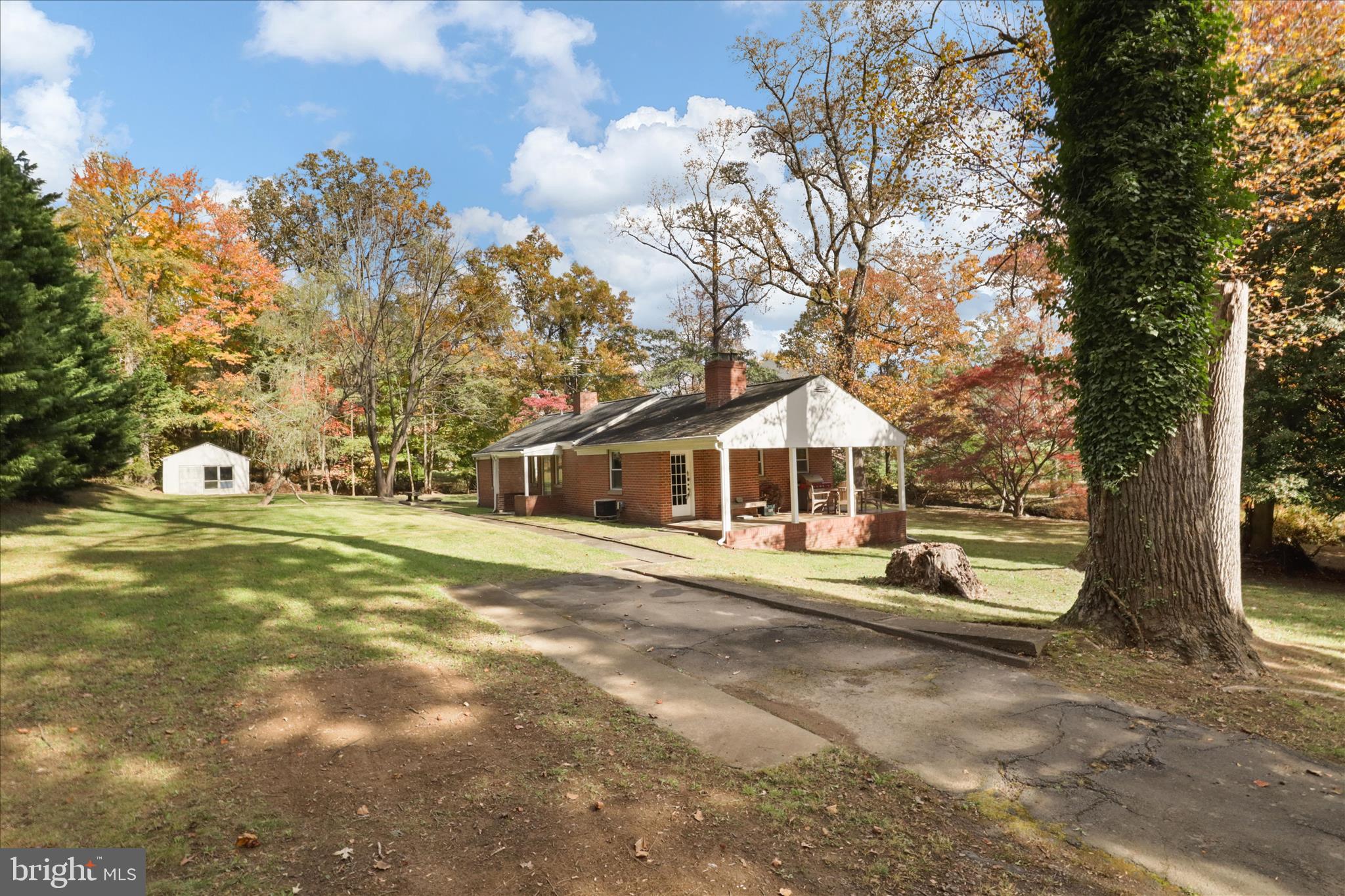 7914 Idylwood Road Dunn Loring, VA 22027 - Photo 4 of 41 a view of a house with a yard and large trees
