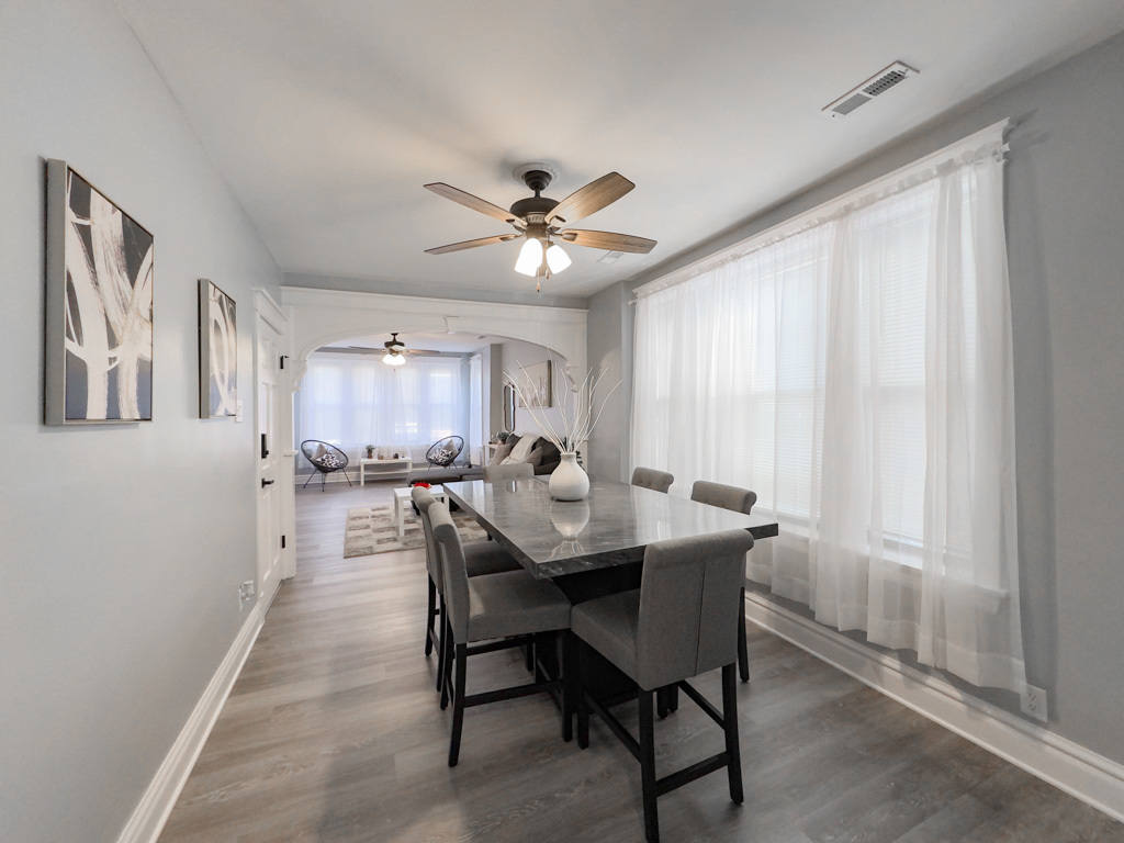 2039 West 23rd Street, Unit 2 Chicago, IL 60608 - Photo 13 of 21 a view of a dining room with furniture and a window