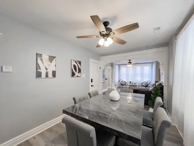 a view of a dining room with furniture and a window