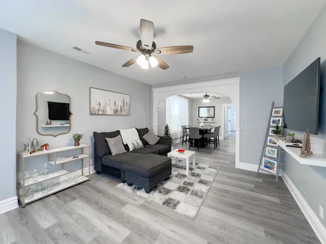 a living room with furniture and a flat screen tv