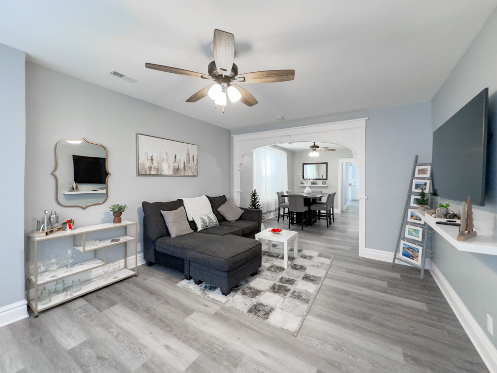 2039 West 23rd Street, Unit 2 Chicago, IL 60608 - Photo 18 of 21 a living room with furniture and a flat screen tv