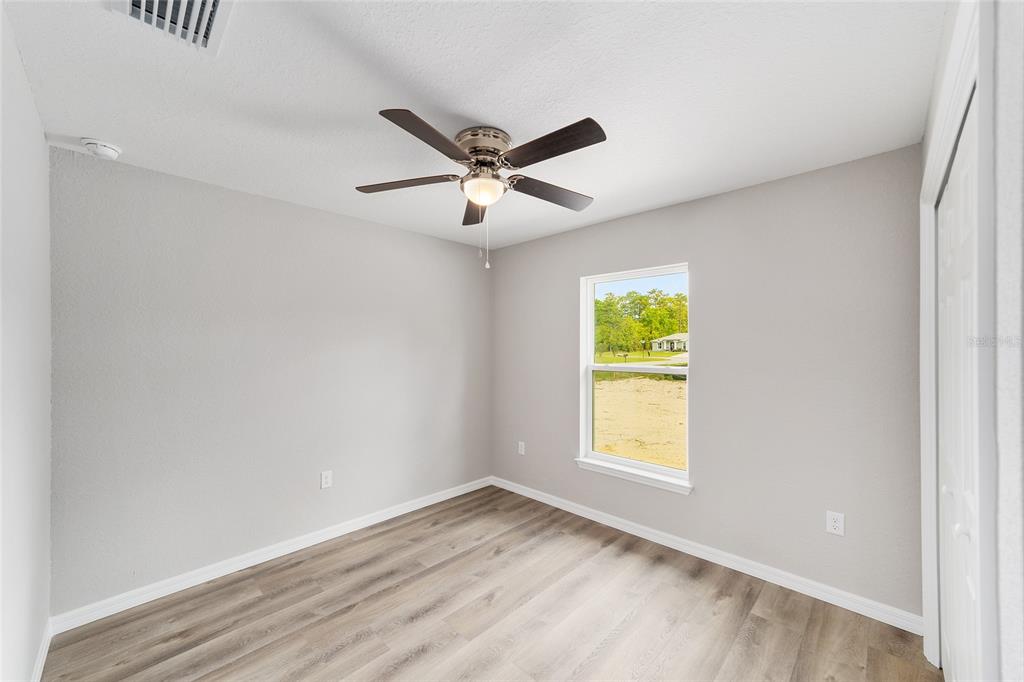 8767 North Quarry Way Dunnellon, FL 34434 - Photo 13 of 18 a view of an empty room with a window