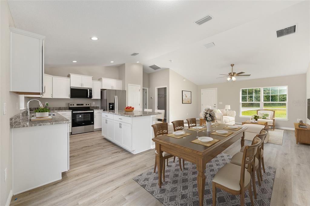8767 North Quarry Way Dunnellon, FL 34434 - Photo 3 of 18 a view of a dining room with furniture window and wooden floor