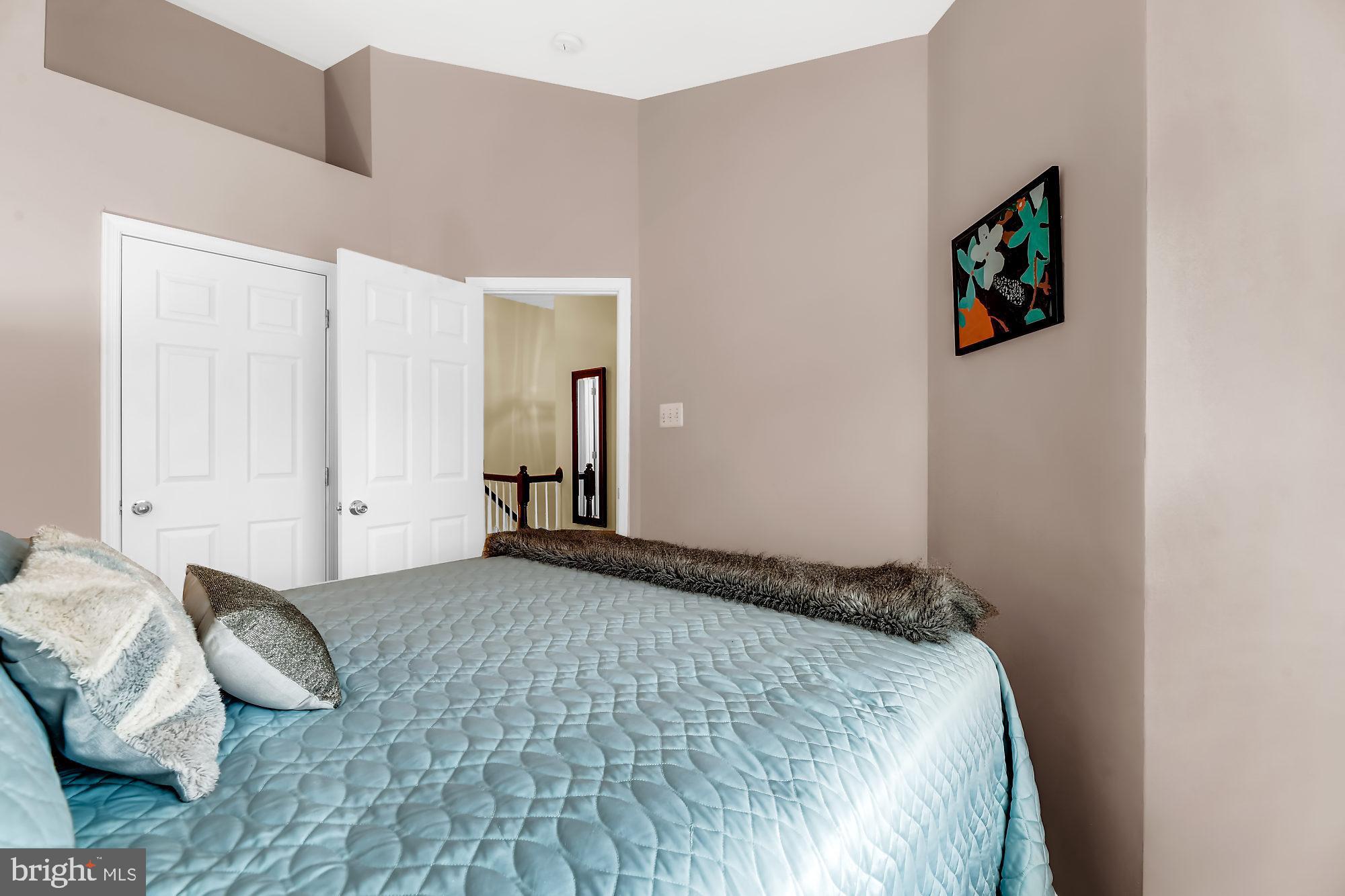 2090 Clipper Park Road Baltimore, MD 21211 - Photo 19 of 75 a bedroom with a bed and a couch