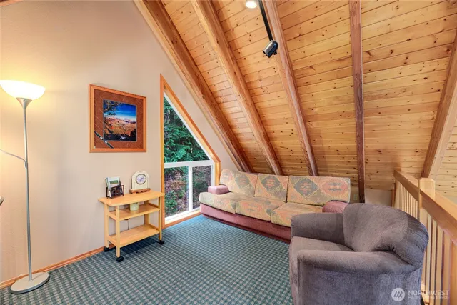 a living room with furniture and a rug