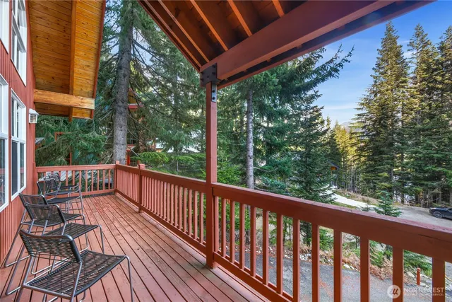 a balcony with wooden floor and outdoor space