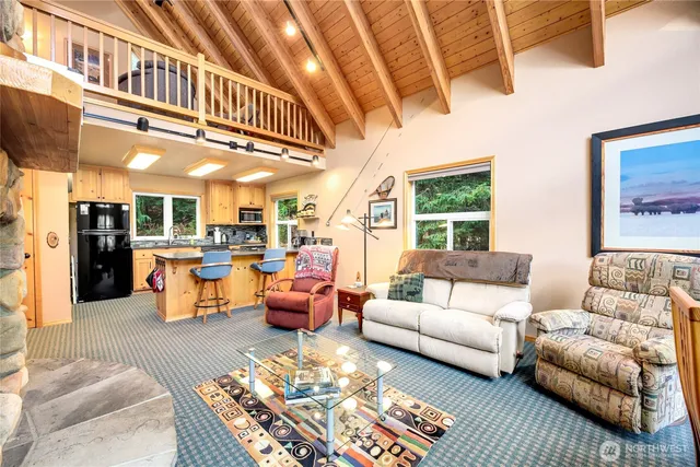 a living room with furniture or couch and a table