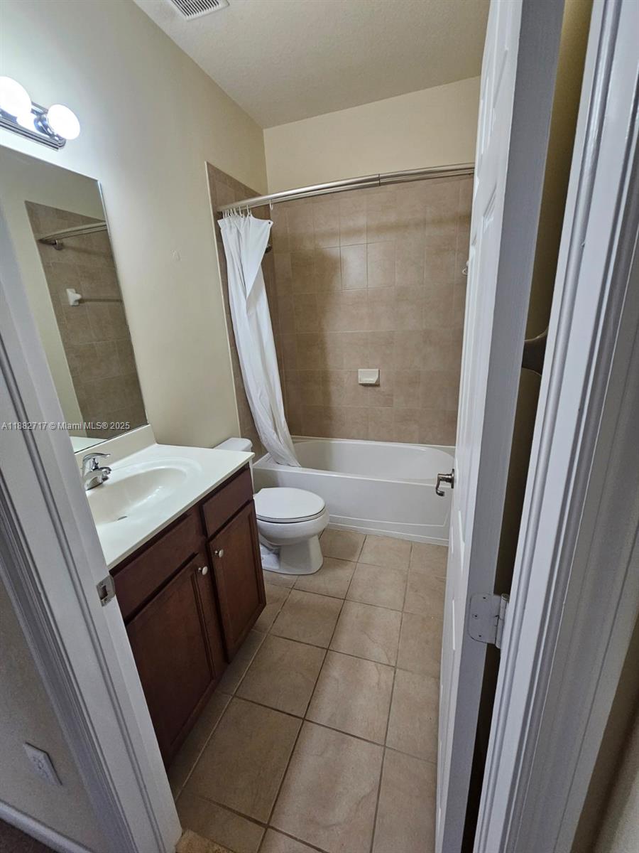 3387 West 90th Street Hialeah, FL 33018 - Photo 10 of 11 a bathroom with a granite countertop sink toilet and shower