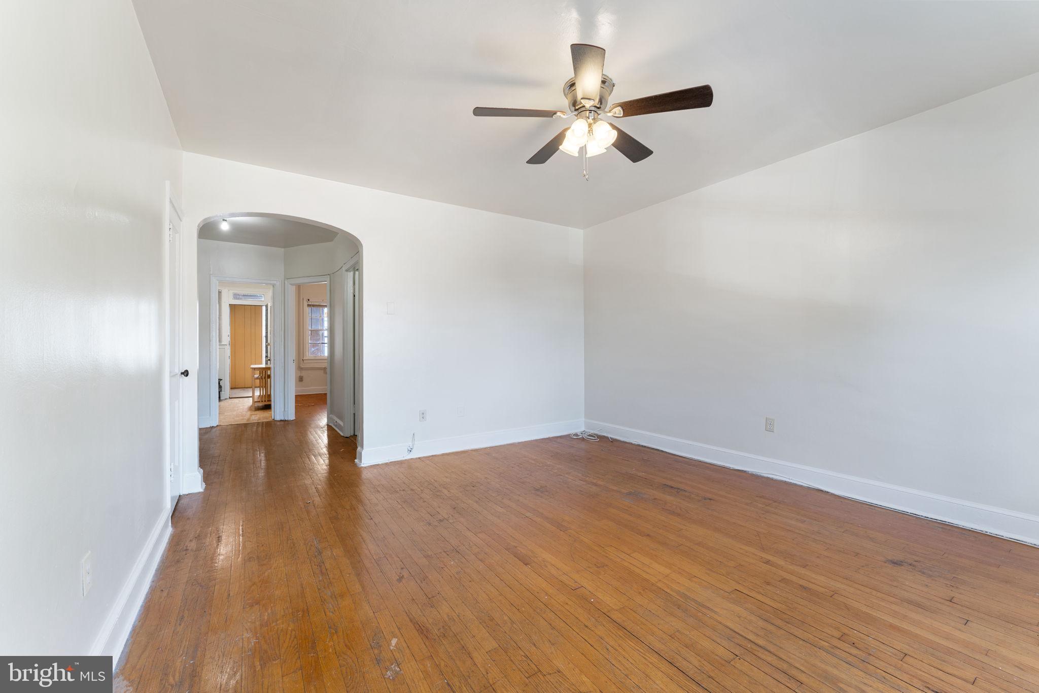 1408 Holbrook Street Northeast Washington, DC 20002 - Photo 12 of 20 wooden floor in an empty room with a window