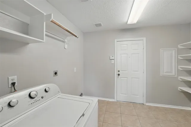 a room with a table and chairs