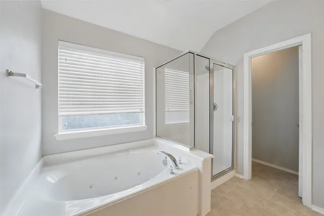a white bath tub sitting next to a window