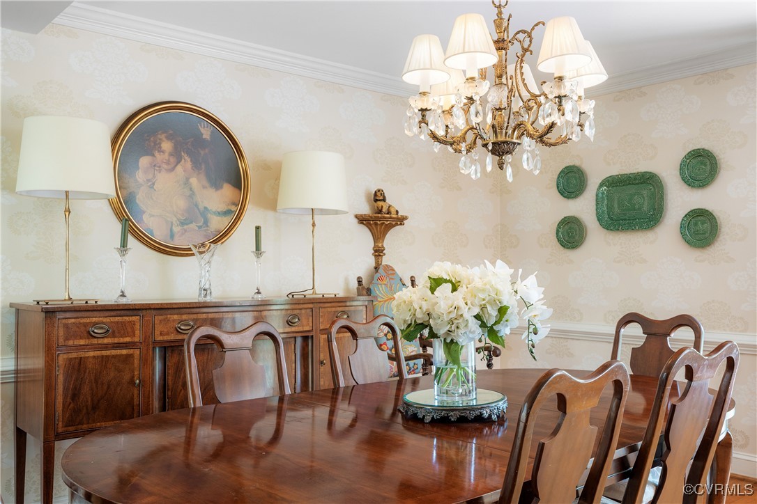 9603 River Road Henrico, VA 23229 - Photo 12 of 50 a dining room with furniture a chandelier and a rug