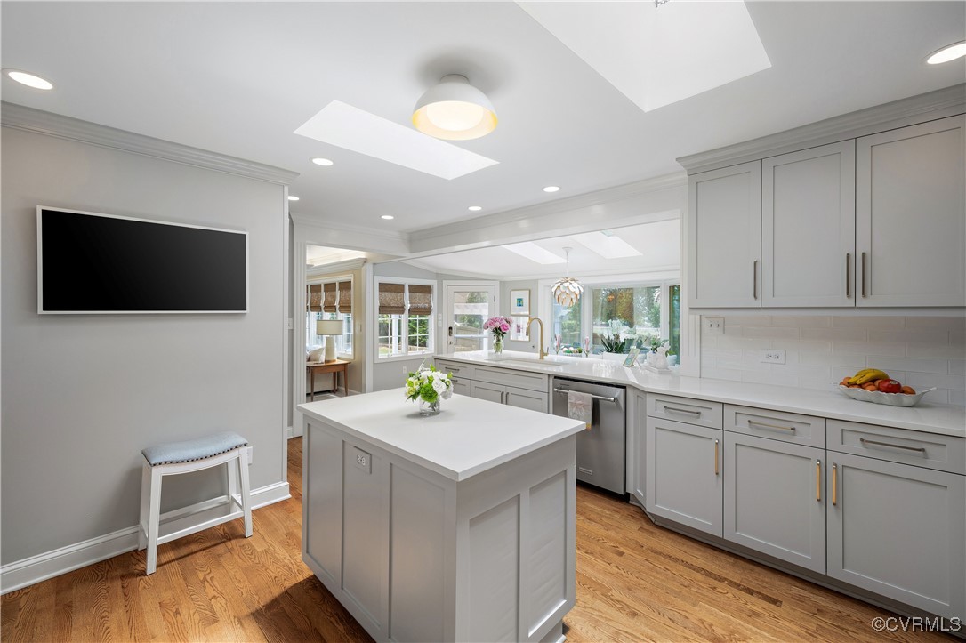 9603 River Road Henrico, VA 23229 - Photo 13 of 50 a kitchen with a sink cabinets and wooden floor
