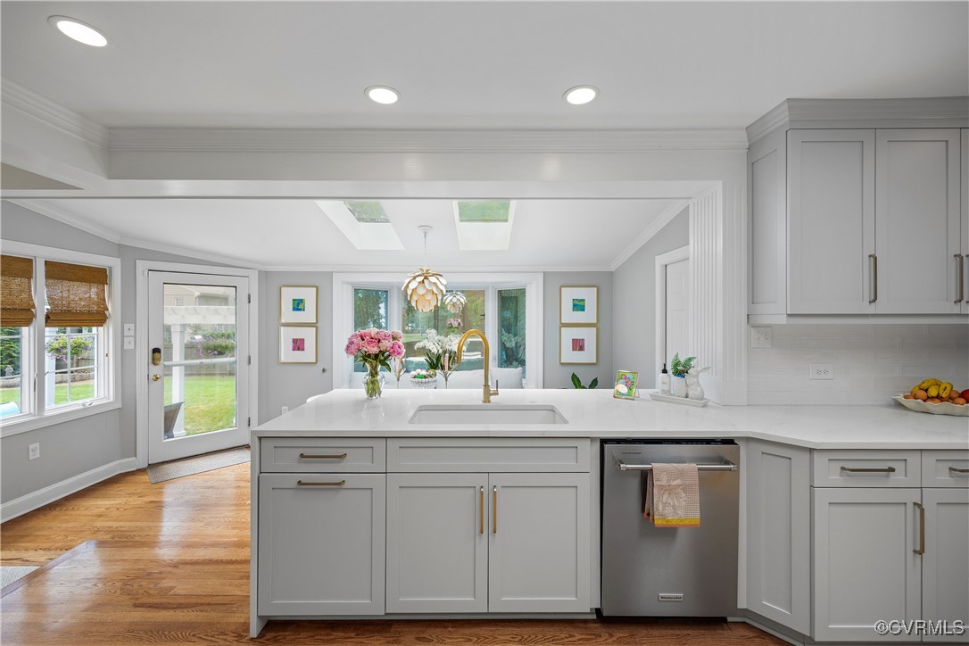 9603 River Road Henrico, VA 23229 - Photo 14 of 50 a kitchen with kitchen island granite countertop a sink cabinets and wooden floor