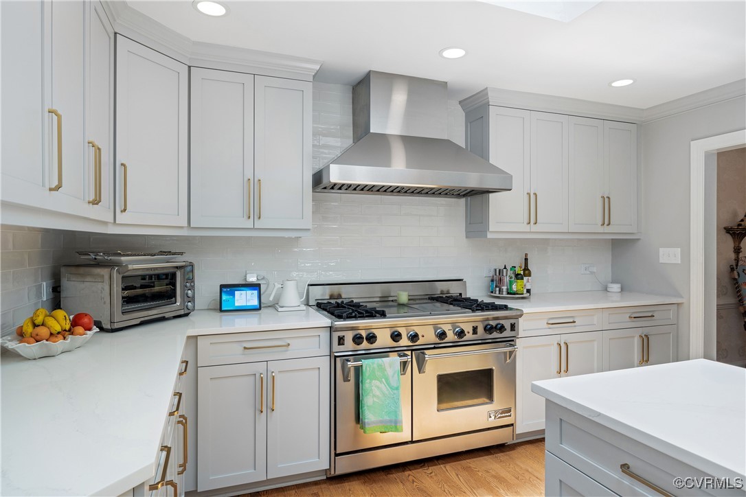 9603 River Road Henrico, VA 23229 - Photo 17 of 50 a kitchen with stainless steel appliances granite countertop a stove and white cabinets