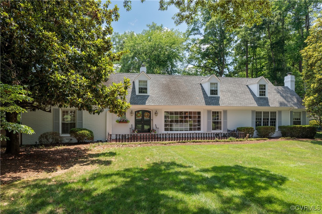 9603 River Road Henrico, VA 23229 - Photo 2 of 50 a front view of house with yard and trees in the background
