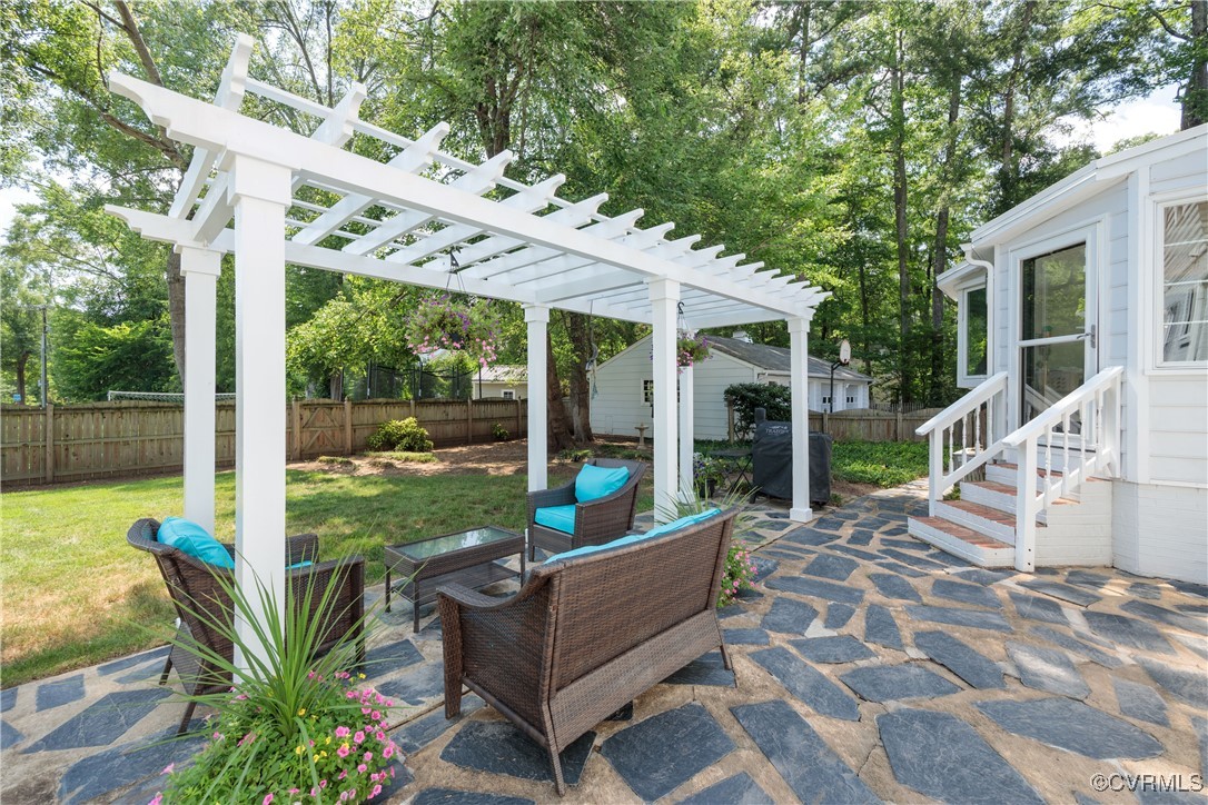9603 River Road Henrico, VA 23229 - Photo 42 of 50 a view of a patio with chairs and floor to ceiling window