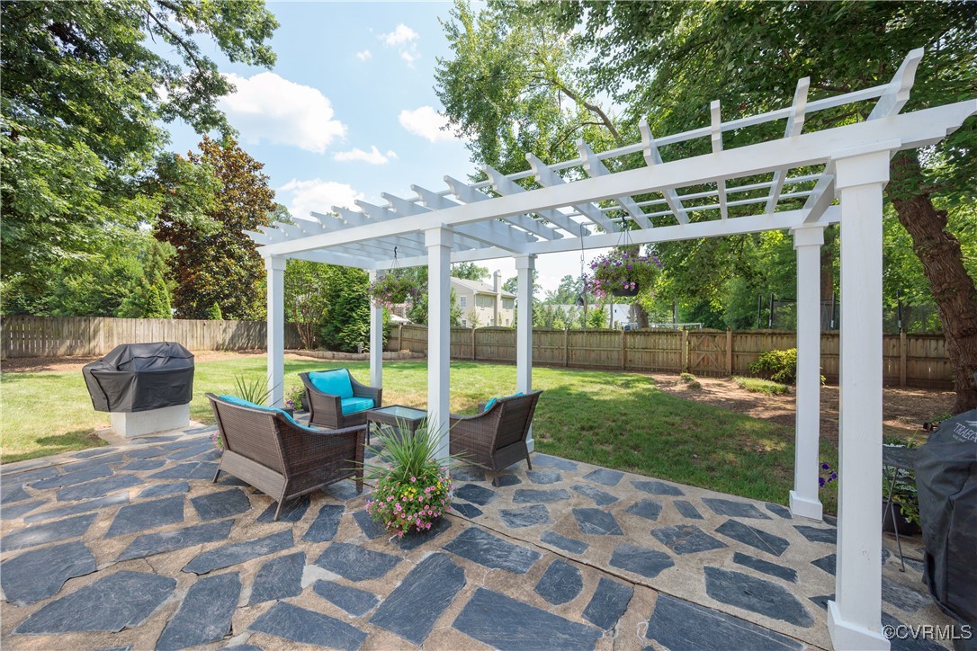 9603 River Road Henrico, VA 23229 - Photo 43 of 50 a view of a patio with a dining table and chairs
