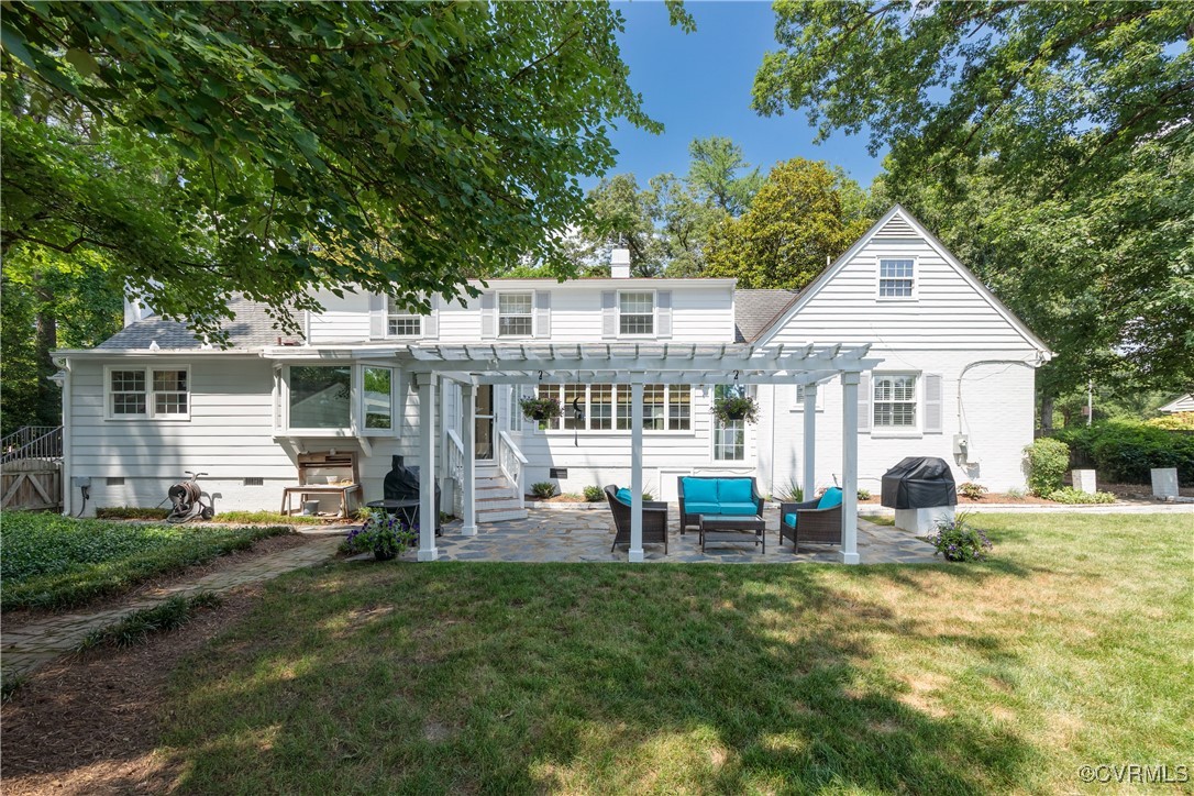 9603 River Road Henrico, VA 23229 - Photo 45 of 50 a front view of a house with a yard patio and fire pit