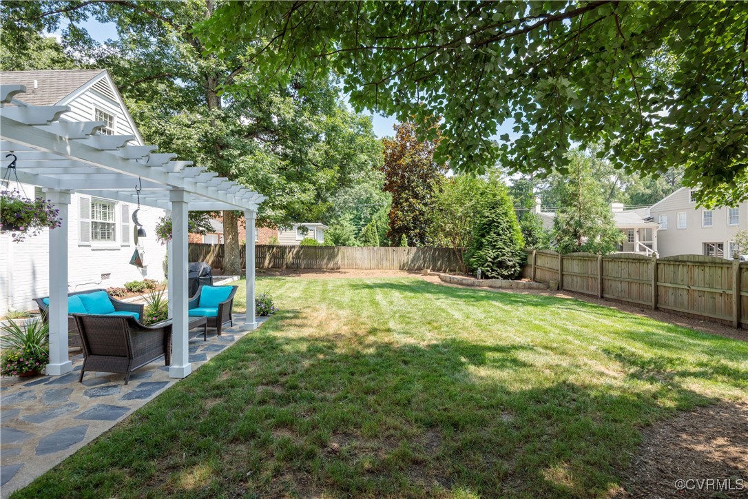 9603 River Road Henrico, VA 23229 - Photo 47 of 50 a view of a backyard with couches plants and large trees