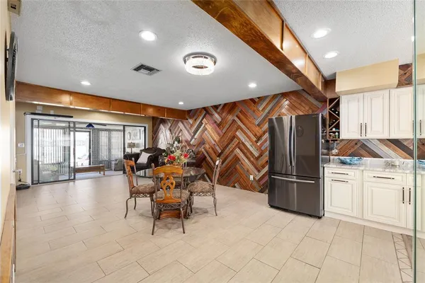a very nice looking kitchen with a large counter space and stainless steel appliances