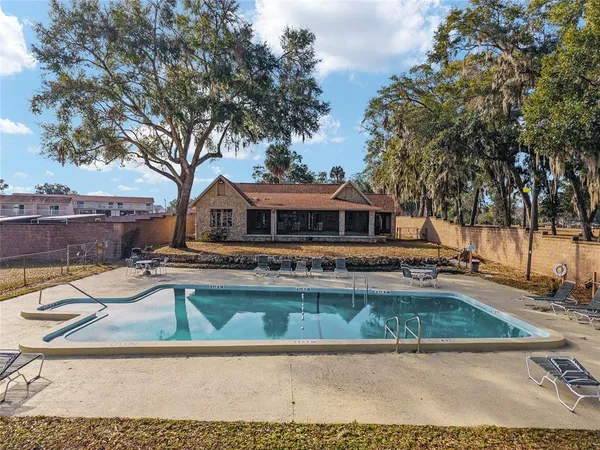 a view of a swimming pool and an outdoor space