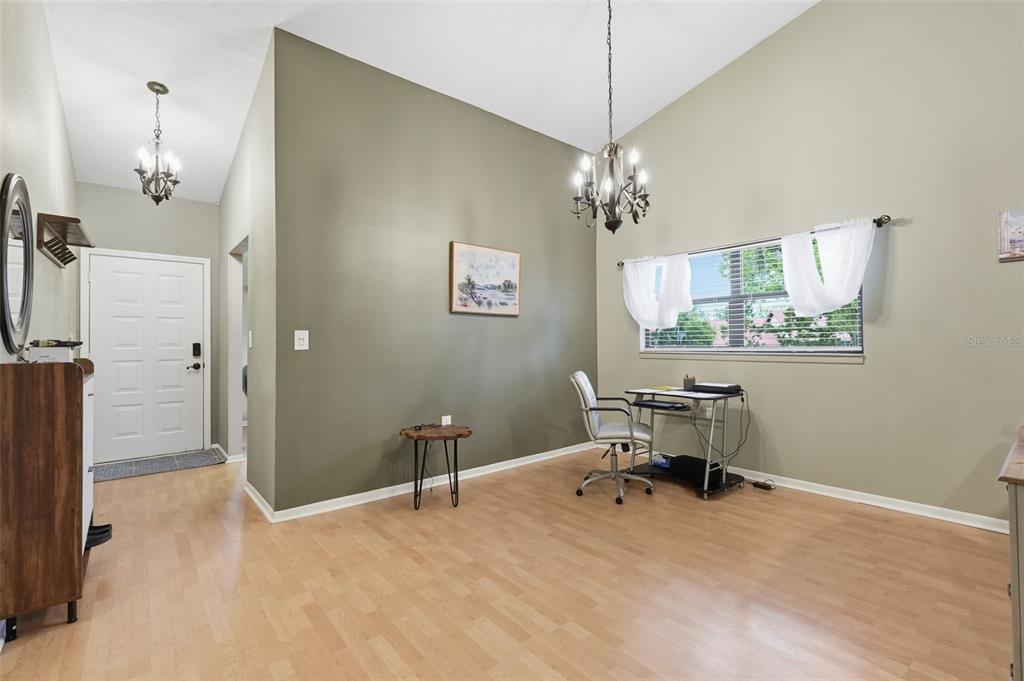 7650 Forest Trail, Unit 6 Port Richey, FL 34668 - Photo 14 of 37 a view of a bedroom with a workspace